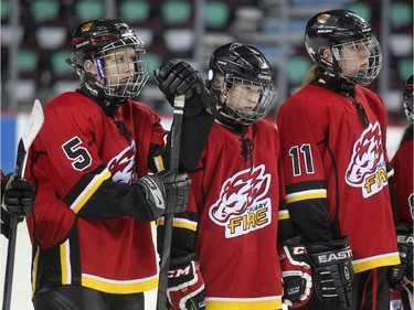 Members of the Calgary Fire watched as their opponent the Saskatoon Stars were awarded the gold medal following the Max's AAA Midget Tournament female final at the Scotiabank Saddledome on January 1, 2015. The Stars defeated the Fire 4-2 to claim the cup.