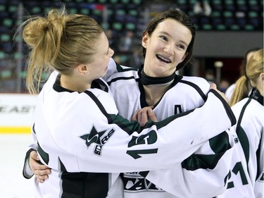 Saskatoon Stars forward Danielle Nogier, left, congratulated teammate centre Sophie Shirley as they celebrated after winning the Max's AAA Midget Tournament female final 4-2 against the Calgary Fire at the Scotiabank Saddledome on January 1, 2015. Shirley scored three goals to help her team claim the championship.