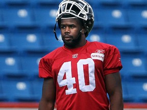 algary Stampeders defensive end Shawn Lemon, 40, during a lull in practice at McMahon Stadium Tuesday August 6, 2013.