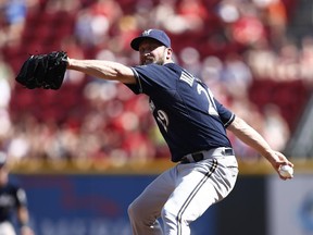 Jim Henderson of the Milwaukee Brewers pitches  against the Cincinnati Reds during a game last season. After off-season shoulder surgery, Henderson is aiming to return to the lineup in time for the start of the 2015 Major League Baseball campaign.