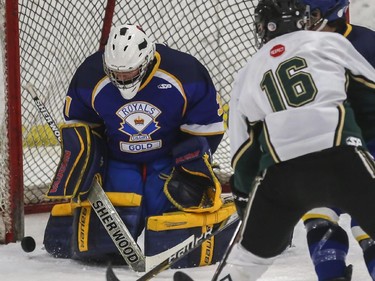 The Royals Gold goalie makes a save in the third period against the Northstar Blazers during the Midget AA finals of the ESSO minor hockey week in Calgary, on January 17, 2015.