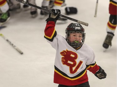 A Bow Valley player pumps his fist in the air in celebration after winning Novice South 4 the finals of the ESSO minor hockey week in Calgary, on January 17, 2015.