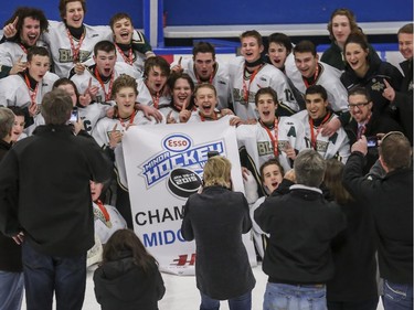 The Northstar Blazers celebrate winning Midget AA gold during the finals of the ESSO minor hockey week in Calgary, on January 17, 2015.