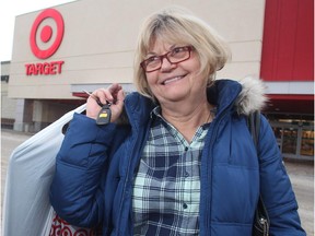 Helen Bugno laments the impending closure of Canadian Target stores as she carries her purchases out of the Market Mall location Thursday, January 15, 2015.