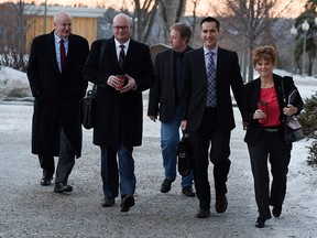 Neil Brown, Jeff Wilson, Greg Weadick, Rob Anderson and Kerry Towle walk into the PC caucus meeting together at Government House in Edmonton Wednesday. It was the first caucus meeting involving  the Wildrose defectors and Tory MLAs.