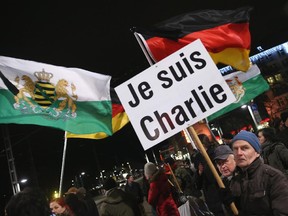 A protester in Dresden, Germany, waves an "I am Charlie" sign. But being Charlie isn't something that is necessarily admirable, says Naomi Lakritz.