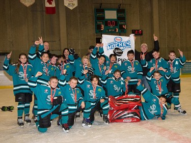 The Atom 8 champions in the 2015 Esso Minor Hockey Week.
