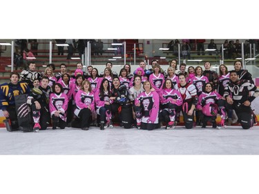 All the moms with their Calgary AAA Flames playing sons after the Northwest Calgary Athletic Association's 5th annual "Pink in the Rink" fundraiser in Calgary, on January 17, 2015.