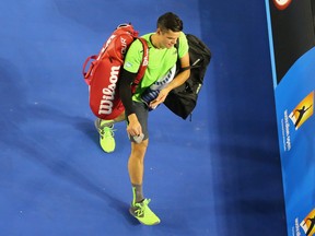 Canada's Milos Raonic leaves the court after losing his quarter-final match against Novak Djokovic.