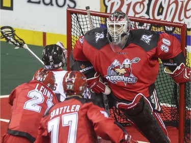 The Roughnecks goalie Mike Poulin watches as a Vancouver Stealth takes aim during the Roughnecks home opener in Calgary, on January 3, 2015. The Roughnecks couldn't pull it together eventually succumbing to the Stealth 18 to 14.