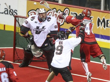 The Roughnecks Dane Dobbie fires a shot at Vancouver Stealth's goalie Tyler Richards during the Roughnecks home opener in Calgary, on January 3, 2015. The Roughnecks couldn't pull it together eventually succumbing to the Stealth 18 to 14.