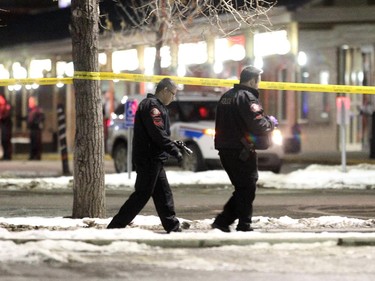 Police investigated a shooting in the parking lot of the Village Square Co-op shopping centre on January 14, 2015.