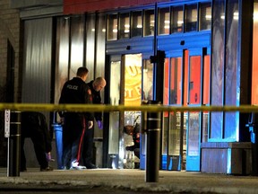 Police investigated a shooting in the parking lot of the Village Square Co-op shopping centre on January 14, 2015.