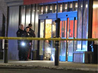 Police investigated a shooting in the parking lot of the Village Square Co-op shopping centre on January 14, 2015.
