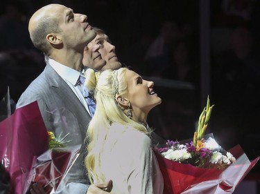 Former Calgary Hitmen star Ryan Getzlaf, now Anaheim Ducks captain, watches as his banner ascends to the ceiling of the Saddledome with his wife and others as he is feted in pre-game ceremony before the Hitmen host the Regina Pats in Western Hockey League action in Calgary, on January 18, 2015.