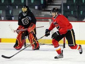 Calgary Flames forward Joe Colborne skates during practice at the Scotiabank Saddledome on Tuesday. He was again asked for reaction about a former coach getting fired when Randy Carlyle was let go by the Leafs on Tuesday.