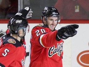 Calgary Flames Curtis Glencross, right, celebrates a goal against the Edmonton Oilers.