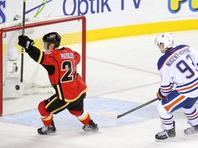 Calgary Flames Jiri Hudler, left, celebrates his teammate's overtime goal on the Edmonton Oilers during their game at the Scotiabank Saddledome in Calgary on December 31, 2014.