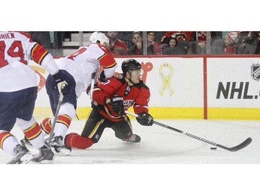 Calgary Flames centre Lance Bouma is knocked to the ice breaking in on net by Florida Panthers defenceman Erik Gudbranson in the third period of Calgary's 6-5 loss Friday night January 10, 2015 at the Saddledome.