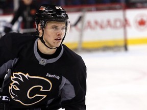 The Calgary Flames recalled defenceman Tyler Wotherspoon, who has travelled across North America twice in the past week.
