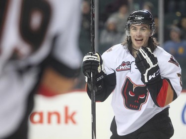 Calgary Hitmen captain Kenton Helgesen celebrates a Hitmen third period goal against the Edmonton Oil Kings in WHL action Saturday January 31, 2015 at the Saddledome.