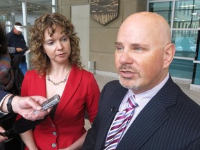 Ian Savage, president of the Criminal Defence Lawyers Association from Calgary, speak to reporters at the Calgary Courts Centre on Monday, March 31, 2014.