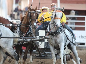 JJason Glass guides his team around the barrels during the dash for cash in heat nine on night ten of the Rangeland Derby chuckwagon finals at Stampede Park in Calgary on Sunday, July 13, 2014.