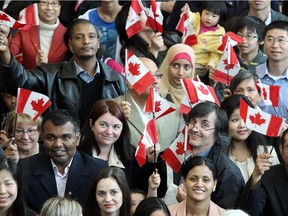 New citizens celebrate their status at a ceremony during the 2012 Stampede.
