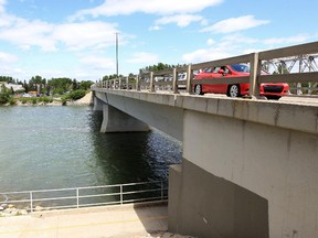 File photo. Shouldice Bridge, over the Bow River, with the community of Bowness in the background in Calgary, Alberta Friday, June 7, 2013.