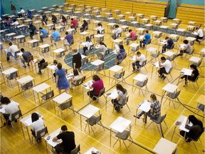 Bishop McNally High School students write a final exam a few years ago.