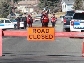 Calgary police investigating the scene on Temple Green Drive where Monisha Sidhu, 26, was slain in 2013.