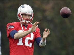 New England Patriots quarterback Tom Brady warms up during practice Friday, in Tempe, Ariz. The Patriots play the Seattle Seahawks in NFL football Super Bowl XLIX Sunday, Feb. 1.