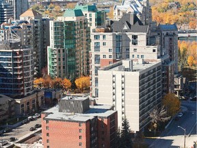 The grey building at right is being sold by the city for $4.5 million to La Caille, which owns the taller condo tower next door. The city will spend more than $1.67 million to demolish the building before the sale is complete.
