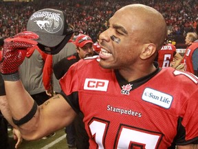 Calgary Stampeders receiver Marquay McDaniel holds his Grey Cup champions cap after the team won the 2014 title in Vancouver on Nov. 30, 2014.
