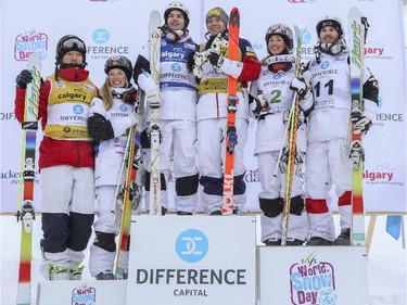 The top three in men's and women's Freestyle moguls skiing 2015 World Cup at Canada Olympic Park in Calgary, on January 3, 2015. From left, and in third places, Sho Endo of Japan, and Justine Dufour-Lapointe of Canada; from right and in second places, Simon Pouliot-Cavanagh and Chloe Dufour-Lapointe both of Canada; and in centre left and in first places, Mikael Kingsbury of Canada and Hannah Kearney of the USA.