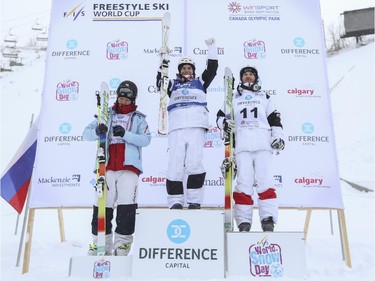 The men's Freestyle moguls skiing 2015 World Cup champions, Mikael Kingsbury of Canada, centre, Simon Pouliot-Cavanagh of Canada, right, and Sho Endo of Japan, on the podium at Canada Olympic Park in Calgary, on January 3, 2015.