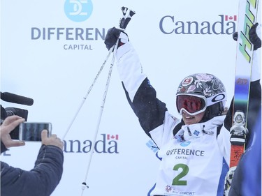Chloe Dufour-Lapointe of Canada celebrates a second place finish at the Freestyle moguls skiing 2015 World Cup at Canada Olympic Park in Calgary, on January 3, 2015.
