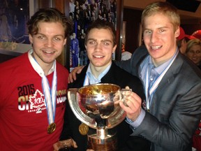 Calgary was well represented on Canada's championship-winning world juniors team. Pictured, from left, with their medals and trophy, are Josh Morrissey, Brayden Point and Dillon Heatherington