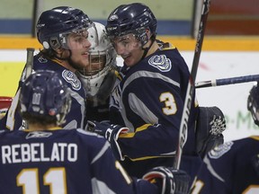 The Calgary Mustangs, seen celebrating a 5-2 win over Okotoks last month, have come from behind in the new year to pass the cross-town rival Calgary Canucks for the final playoff position in the AJHL's South Division, but the Canucks could make it interesting if they win Thursday's final meeting of the season between the two teams.