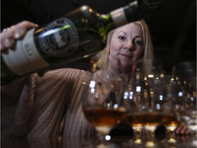 Annabel Meikle, ambassador to the Scotch Malt Whiskey Society, pours the B3.1 bourbon whiskey to be served at the Brasserie in Kensington during an event by the Calgary chapter of the Scotch Malt Whisky Society.