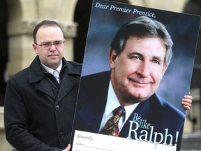 The Canadian Taxpayers Federation Prairie Director Colin Craig with a placard for his group's "Be Like Ralph" campaign.