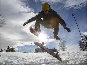 Kyle Michalski, takes advantage of the milder weather and skateboards at Millennium Park in Calgary, on February 7, 2015.