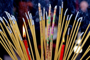 Candles are lit during Chinese New Year celebrations at the Chinese Cultural Centre on February 15, 2015.