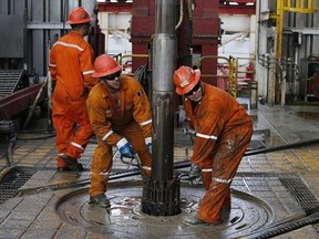 Oil workers set the drill on the Centenario deep-water drilling platform in the Gulf of Mexico off the coast of Veracruz, Mexico. Petroleos Mexicanos, or Pemex, is postponing some deep-water exploration projects in response to a steep drop in global crude prices.