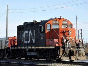 A CN locomotive goes through the CN Taschereau yard in Montreal, Saturday, Nov., 28, 2009. Canada's largest railway has received notice that one of its major unions could go on strike as early as Saturday. THE CANADIAN PRESS/Graham Hughes ORG XMIT: cpt105