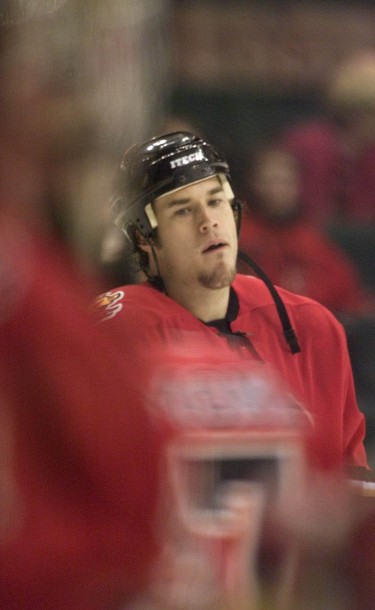 Calgary Flames defenseman Steve Montador warms-up with the team, then heads for the showers on October 18, 2003.