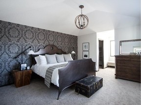 Master bedroom with wallpaper that enhances the room's style.