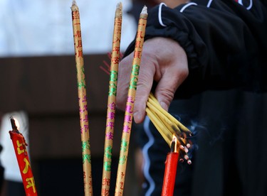 Candles are lit during Chinese New Year celebrations at the Chinese Cultural Centre on February 15, 2015.