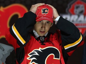 Emile Poirier, shown on his draft day after being selected 22nd overall by the Flames in 2013, has earned his first NHL call-up.