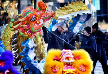 Members of the Jing Wo Lion Dance Team perform during Chinese New Year celebrations at the Chinese Cultural Centre on February 15, 2015.